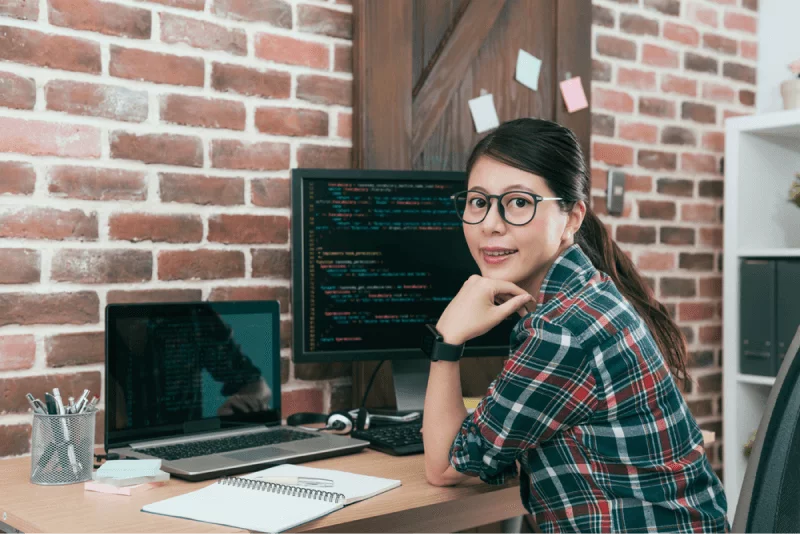 female student taking computer programming