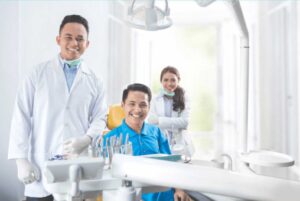 Male dentist and his patients