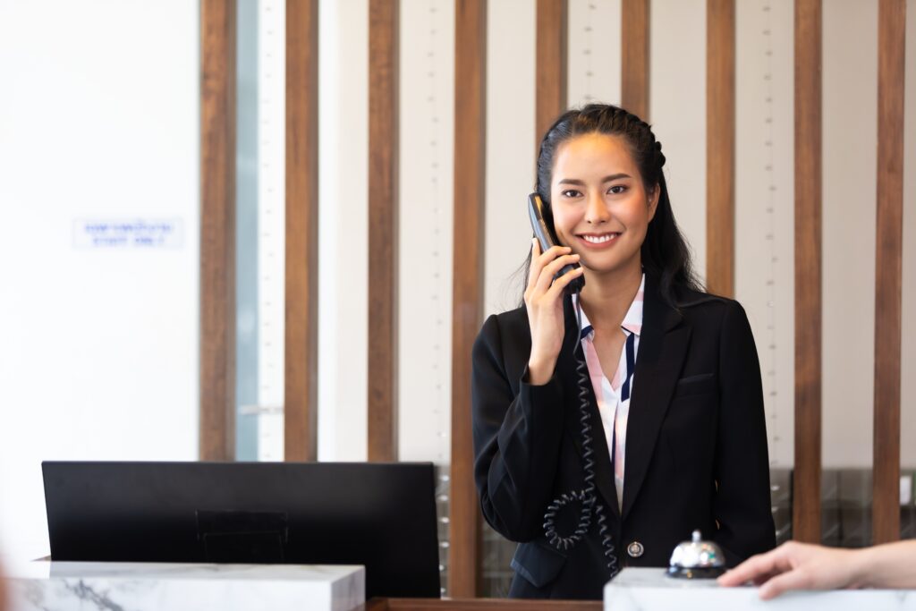 a hotel manager answering a telephone call