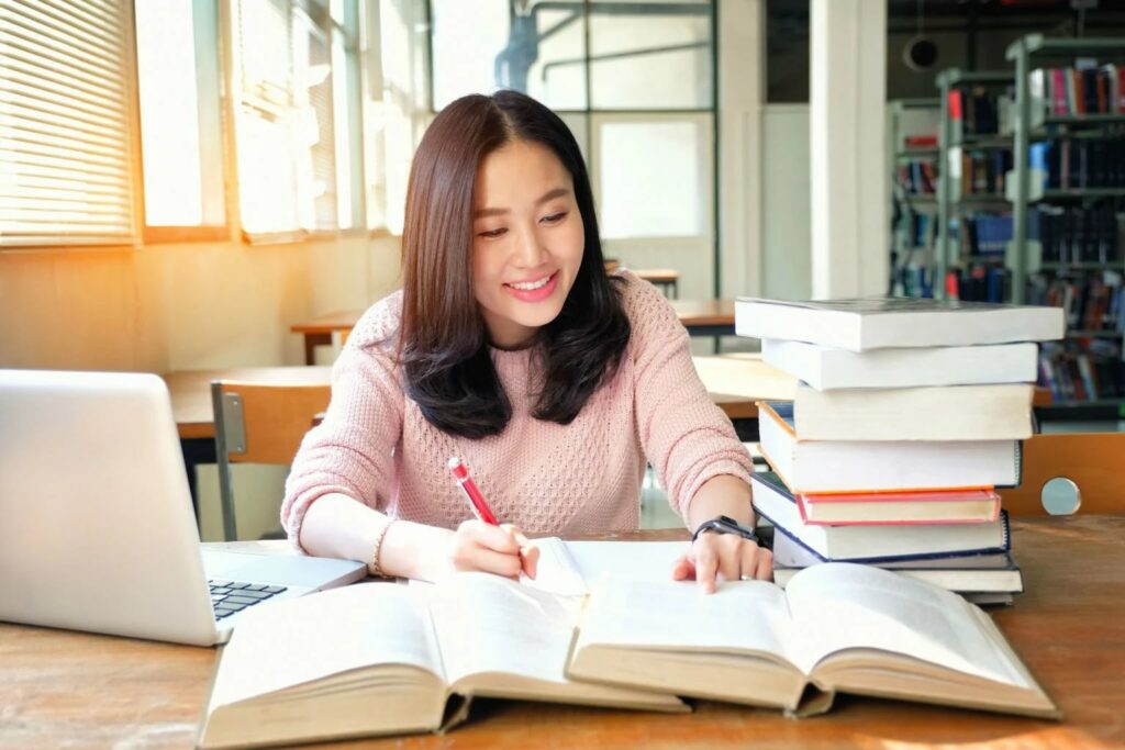 senior high female student studying her books