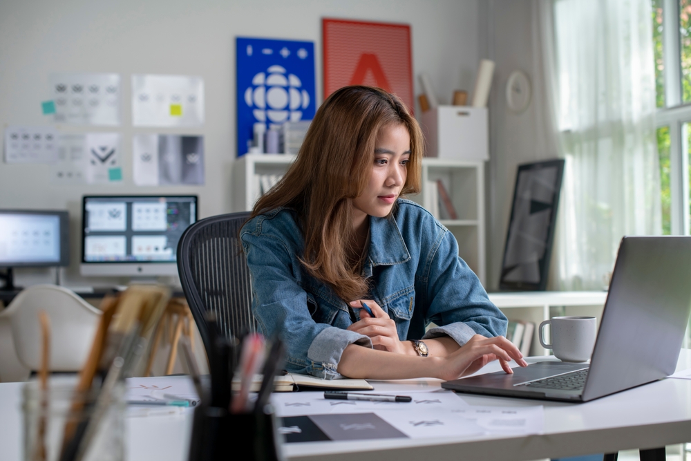 female student thinking of what strand to choose for interior design