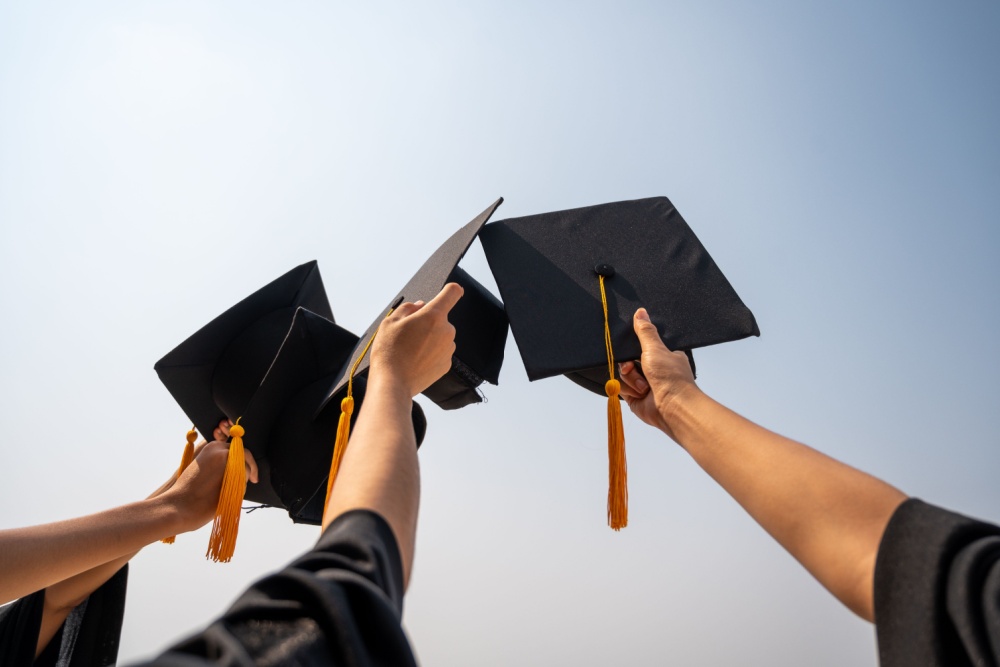 raising graduation cap