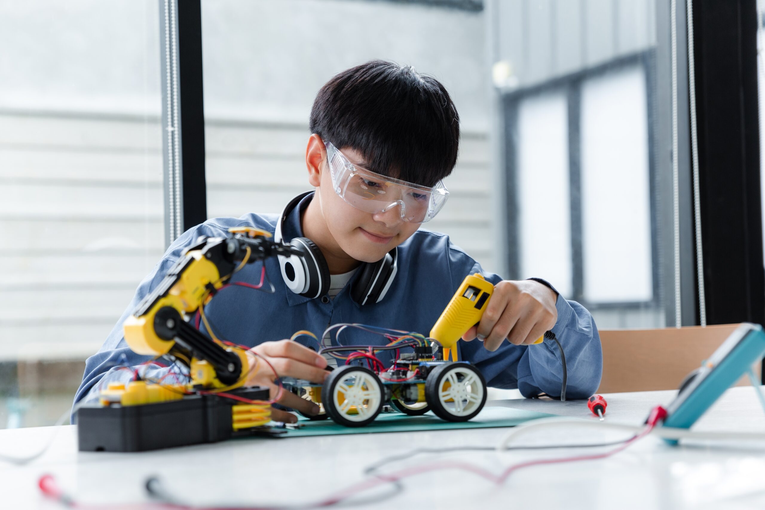 a STEM student building a robot project