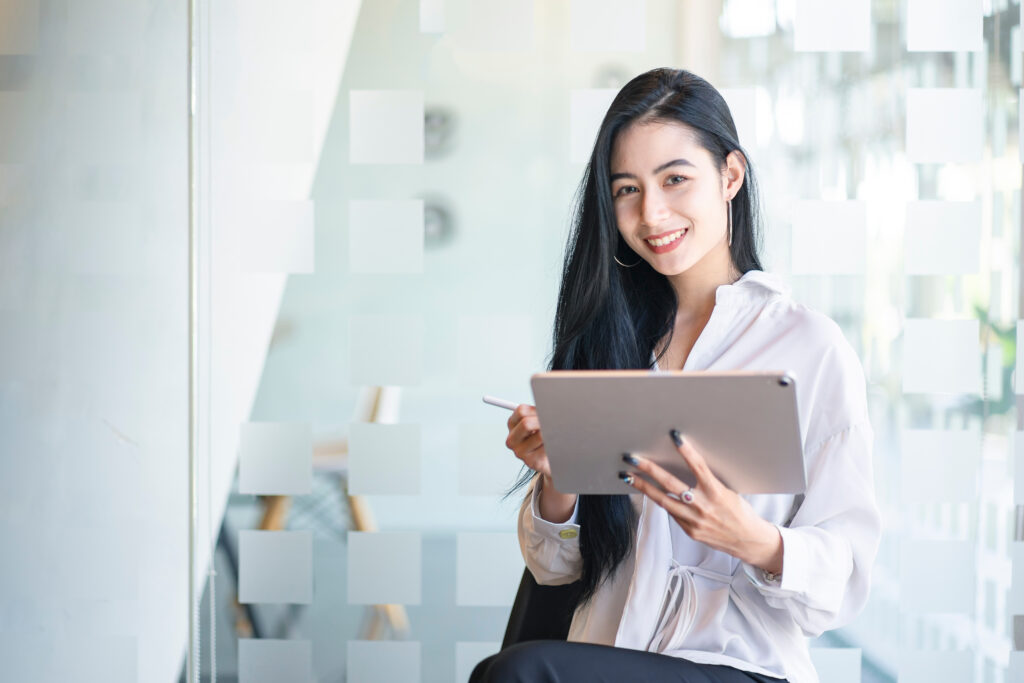 a graphic design holding a tablet