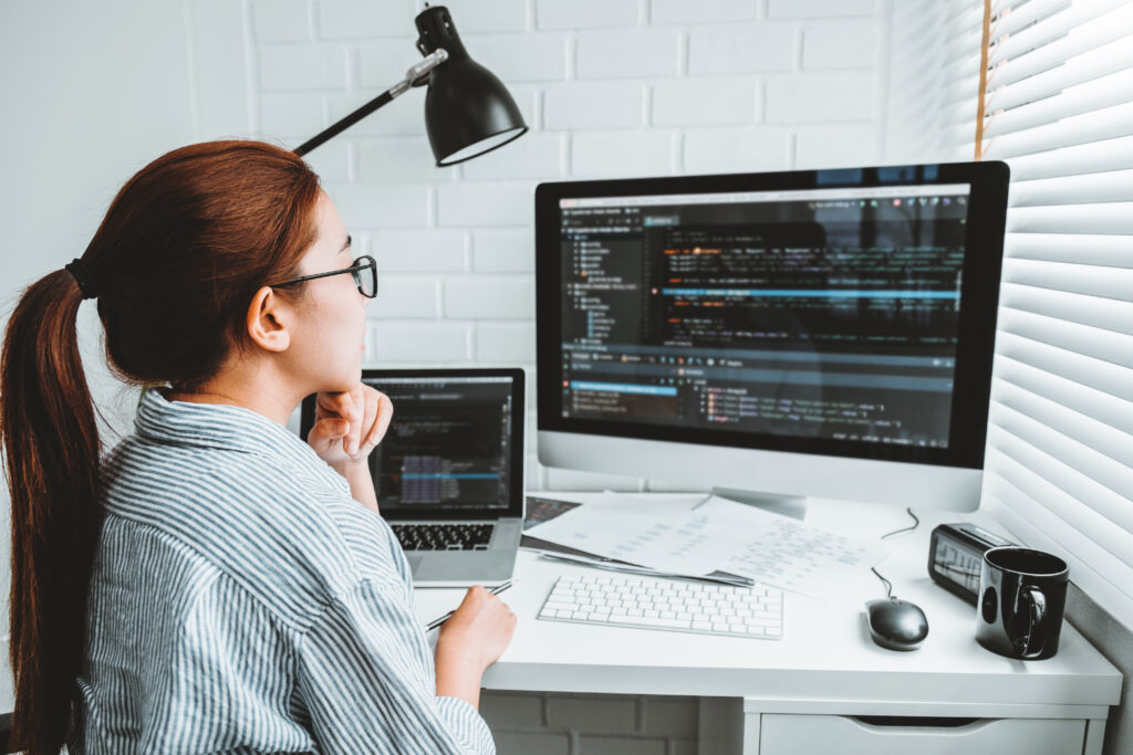 a programmer looking at her code