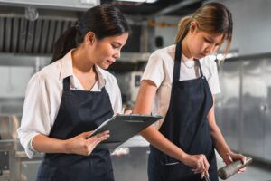 two assistant chefs working in the kitchen