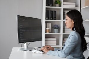 an ICT professional using her laptop