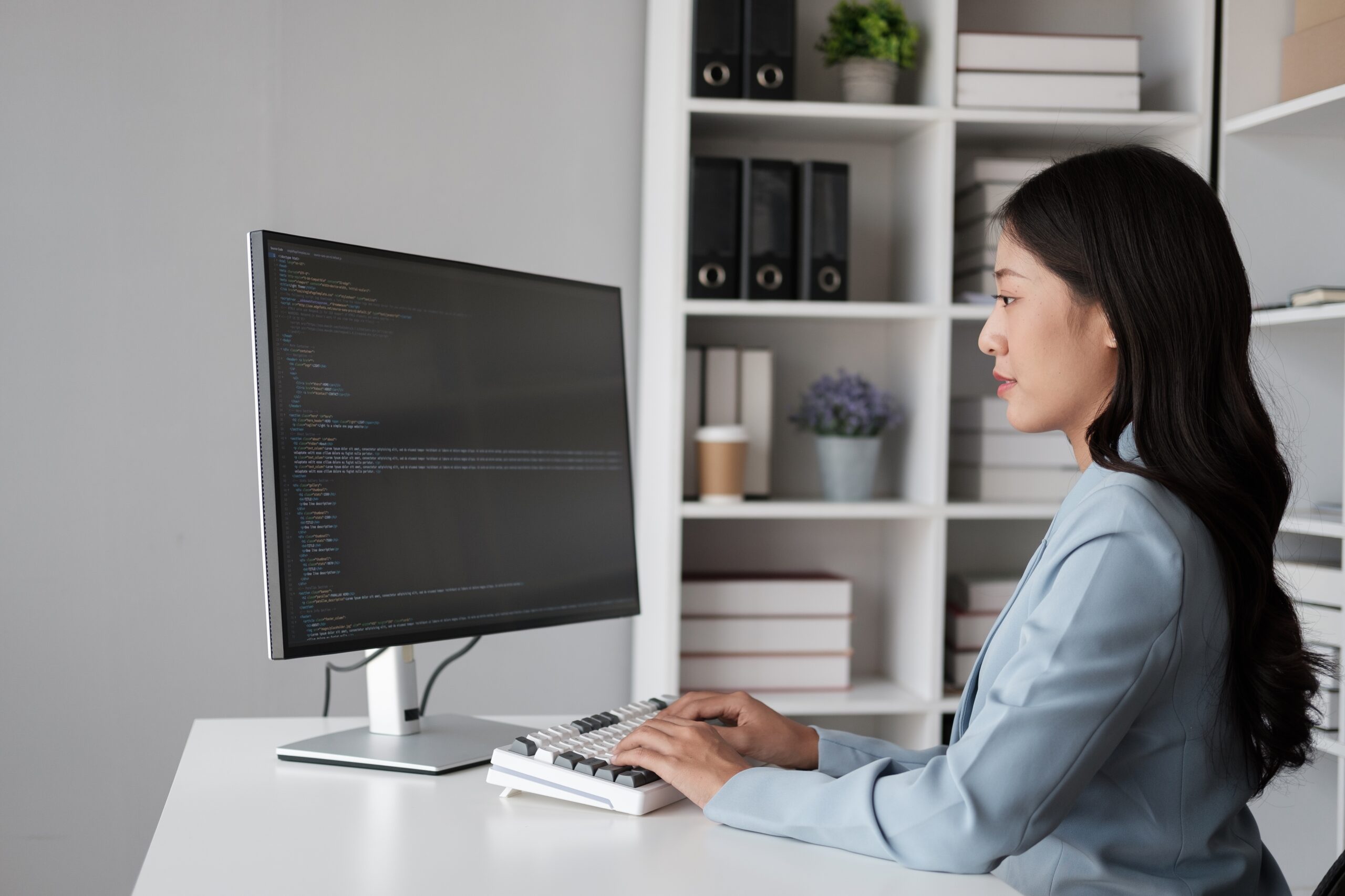 an ICT professional using her laptop