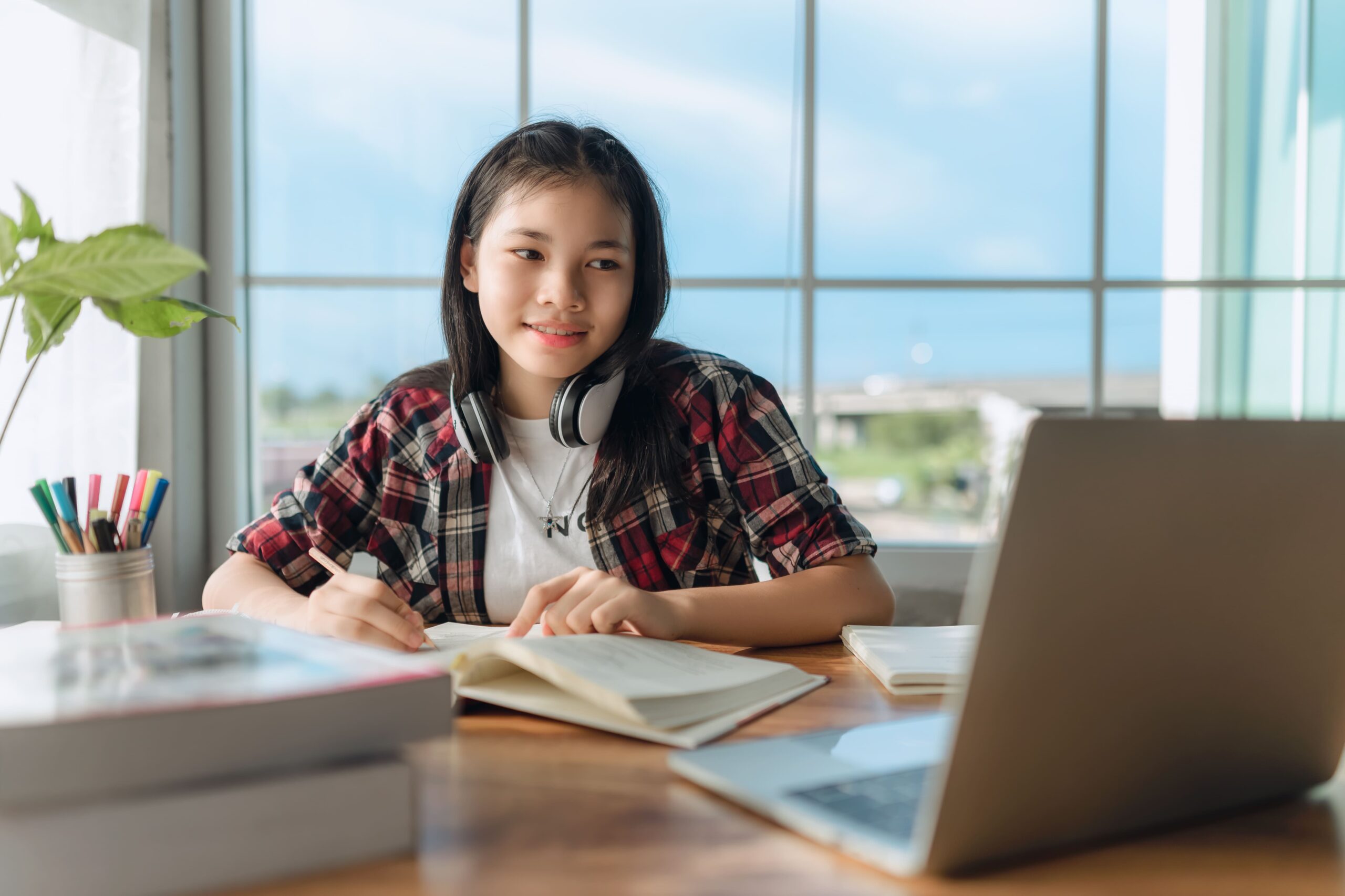 an SHS student studying with a laptop